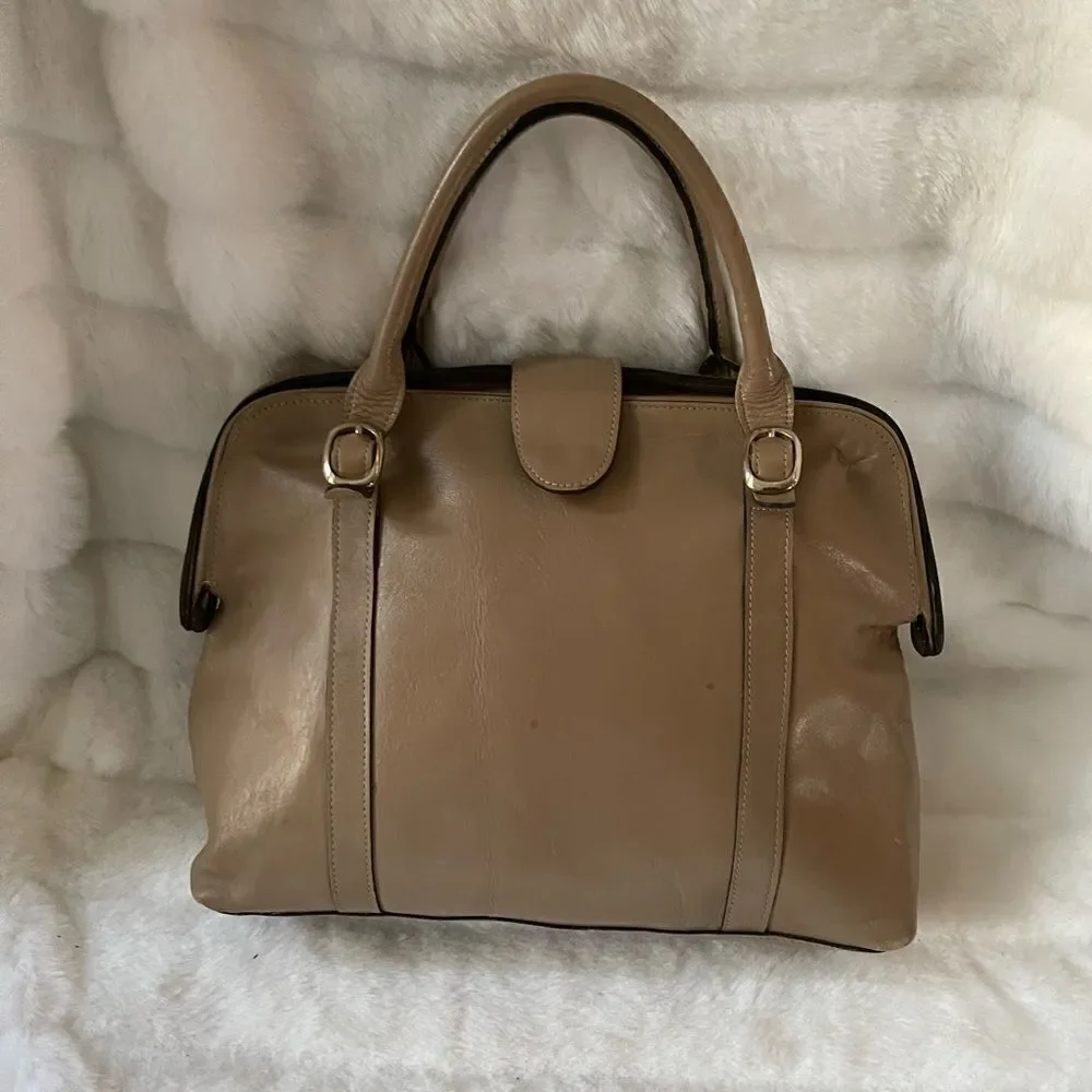 Tano Leather tan frame medium satchel gold tone hardwares .